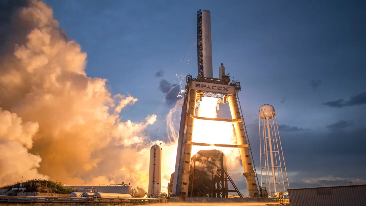 A rocket lifting off from its launch pad in a cloud of flame